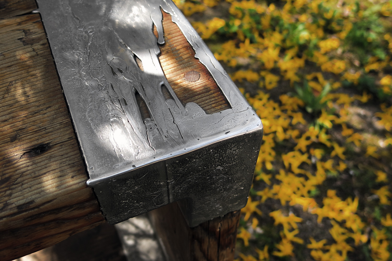 Illustration for article titled Casting Molten Metal On Wood With a Hungarian Design Master